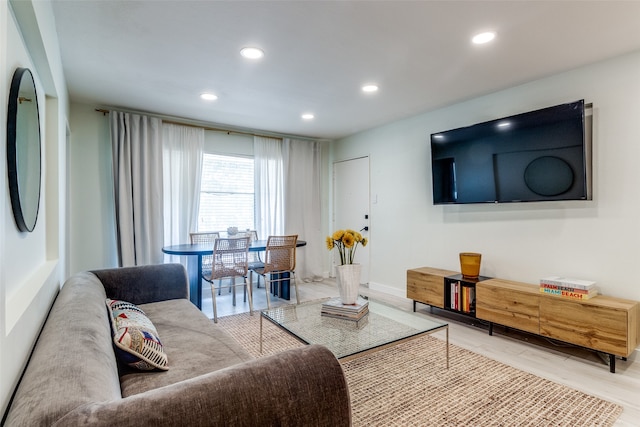 living room with light hardwood / wood-style floors