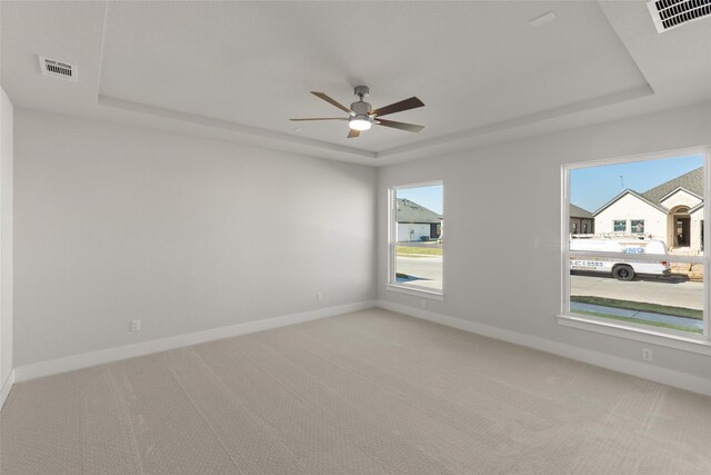 5265 Great Hollow Trl, Fort Worth, TX 76179 - unfurnished room featuring visible vents, a raised ceiling, ceiling fan, and light carpet