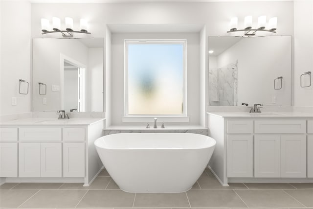 full bathroom featuring a sink, two vanities, a shower, tile patterned flooring, and a freestanding tub