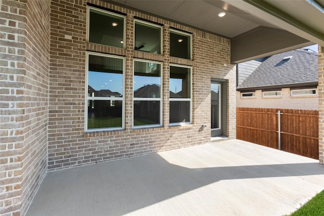 view of patio featuring fence