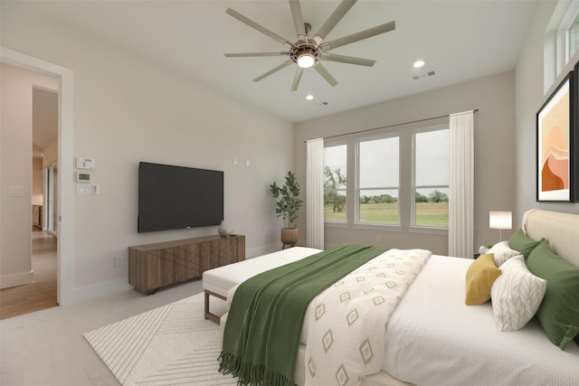 bedroom featuring light carpet and ceiling fan