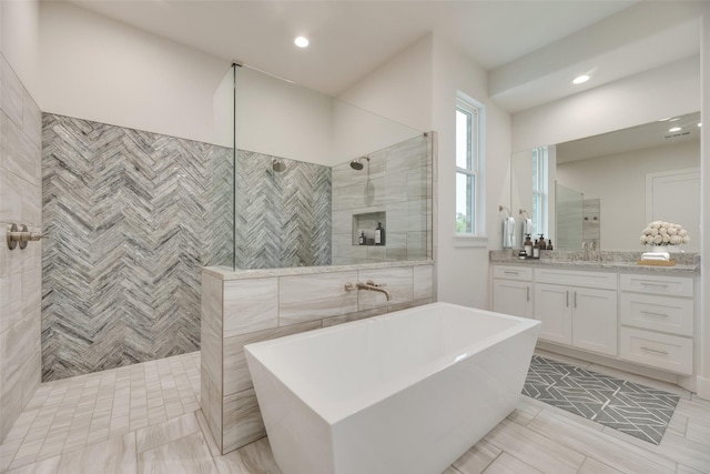 bathroom featuring tile patterned flooring, vanity, and independent shower and bath