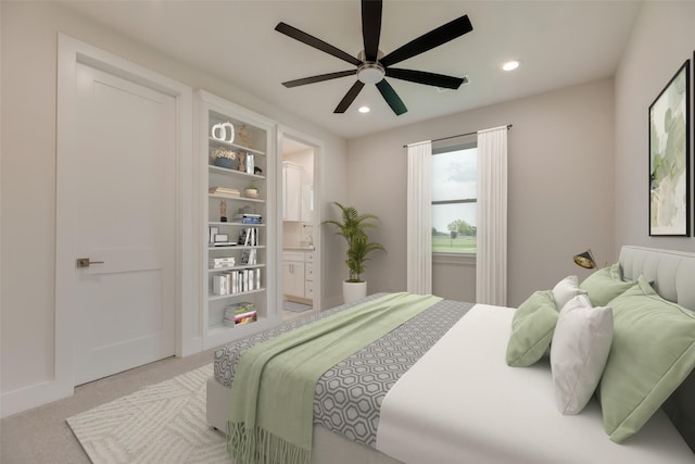 bedroom featuring ceiling fan and light carpet