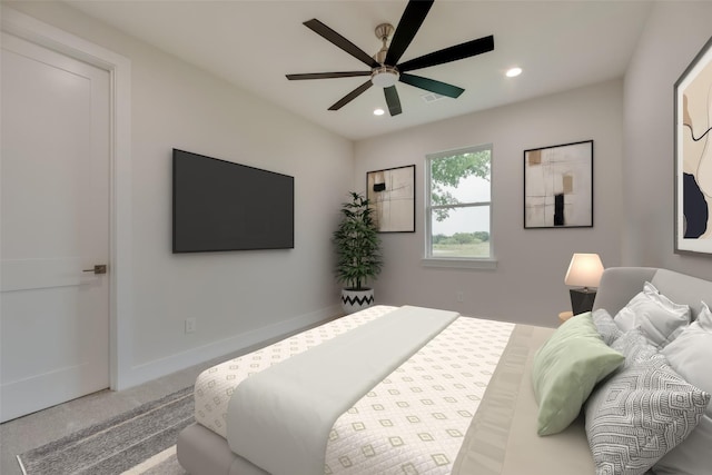 bedroom with ceiling fan and carpet floors