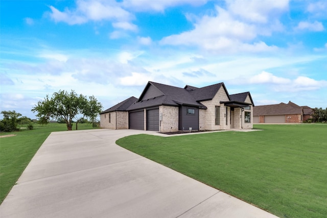 view of front facade with a front yard and a garage