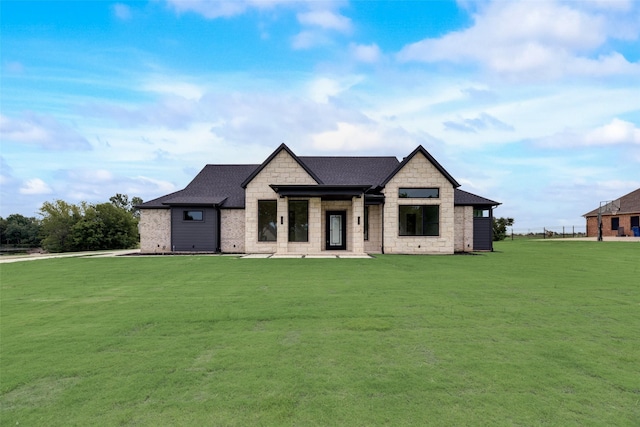 view of front of home with a front yard