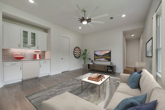 living room with hardwood / wood-style floors and ceiling fan