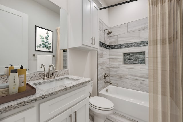 full bathroom with vanity, toilet, and shower / bath combo with shower curtain