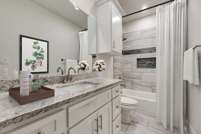 full bathroom featuring vanity, toilet, and shower / tub combo