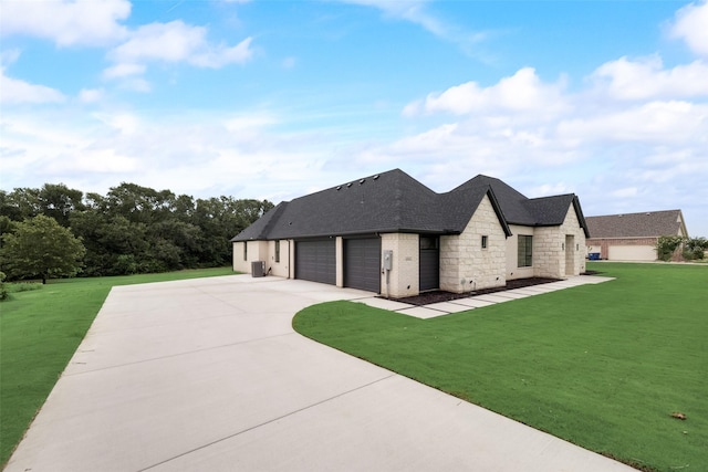 french country inspired facade featuring a front lawn and a garage