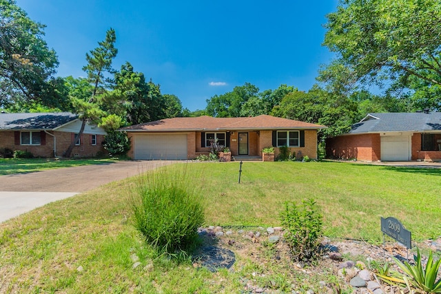 single story home with a garage and a front lawn