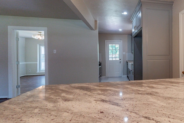 kitchen featuring light stone countertops