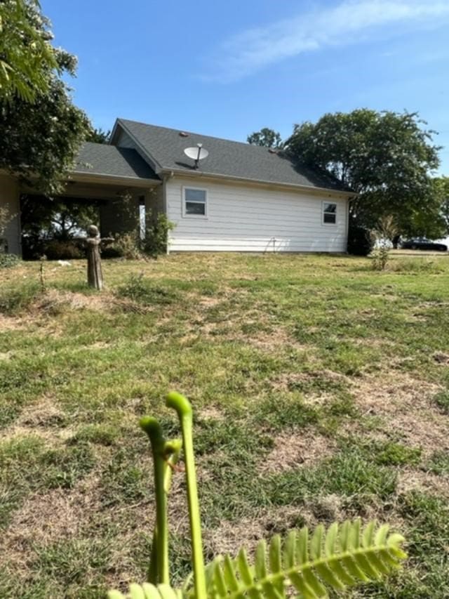 view of home's exterior featuring a lawn