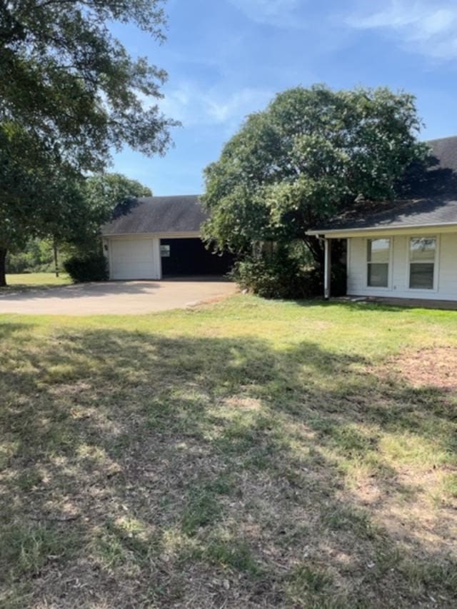 view of yard featuring a garage