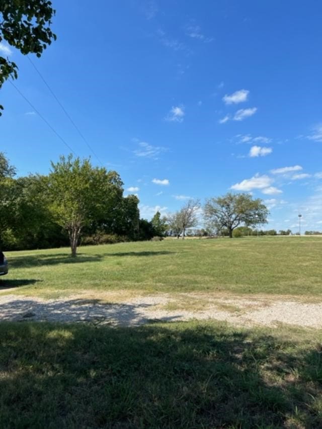 view of yard with a rural view