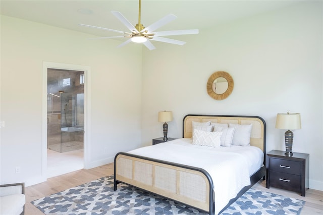 bedroom featuring ensuite bathroom, ceiling fan, and wood-type flooring