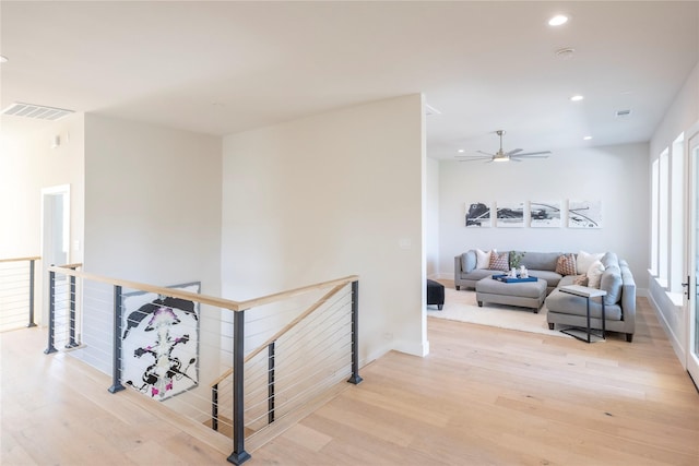 hall with light hardwood / wood-style floors