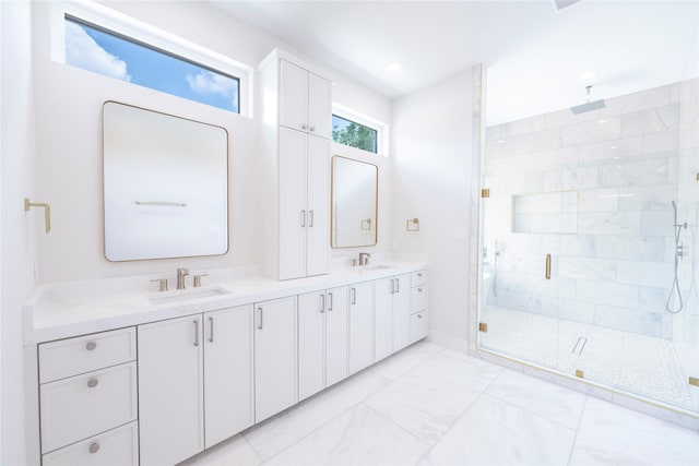 bathroom featuring vanity and an enclosed shower