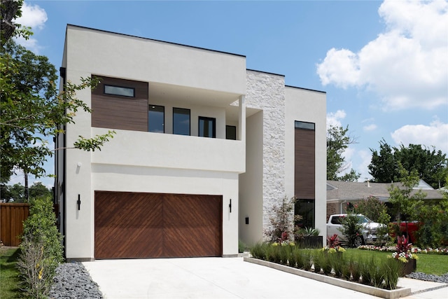 contemporary house with a balcony and a garage