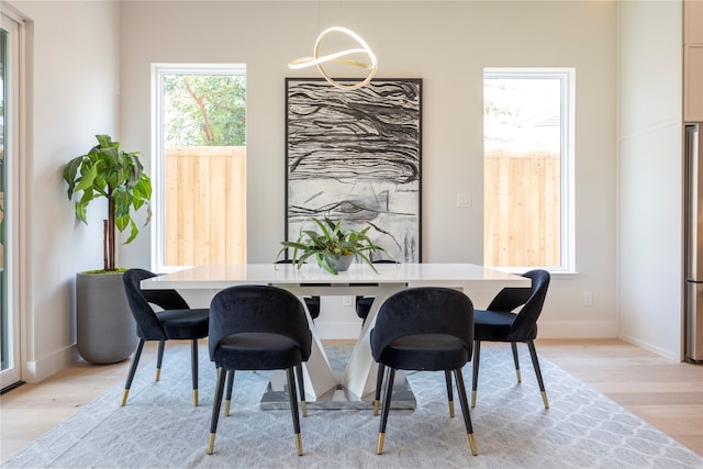 dining area with light wood-type flooring