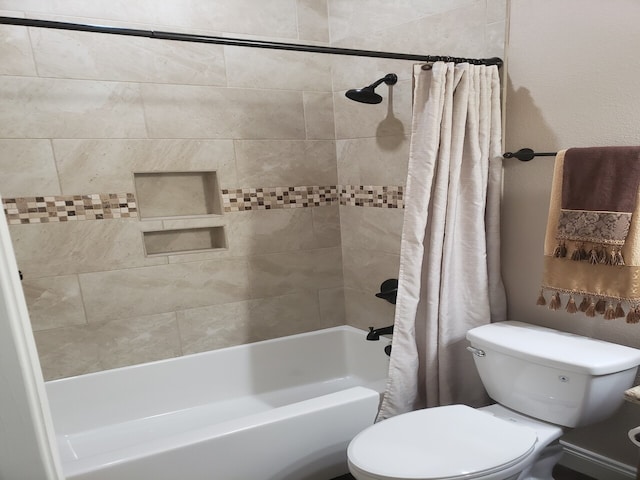 bathroom featuring toilet and shower / bath combo with shower curtain