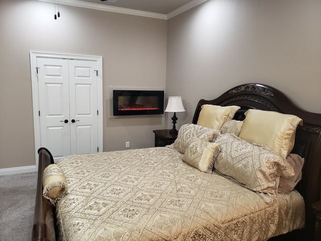 carpeted bedroom featuring a closet and ornamental molding