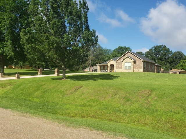 exterior space with a yard