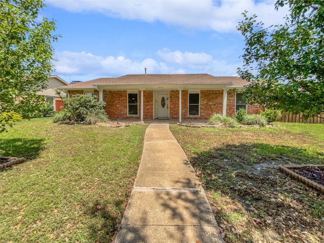 ranch-style house featuring a front lawn