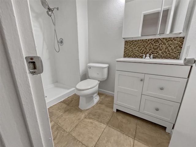 bathroom featuring tile patterned flooring, toilet, backsplash, a shower, and vanity