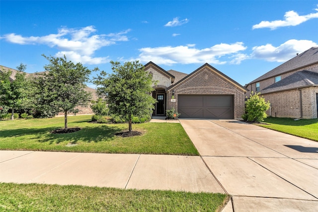 view of front of property featuring a garage and a front yard