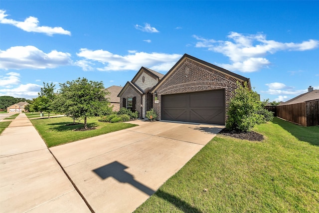 view of front of property featuring a garage and a front yard