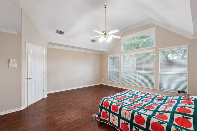 bedroom with ceiling fan, dark hardwood / wood-style flooring, a textured ceiling, vaulted ceiling, and ornamental molding