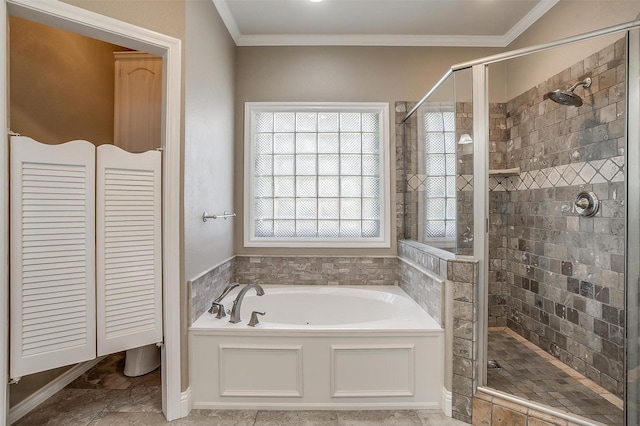 bathroom with a shower stall, a bath, and crown molding