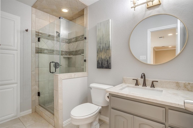 full bathroom featuring visible vents, toilet, a stall shower, vanity, and tile patterned floors