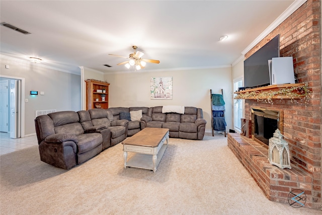 carpeted living room featuring a brick fireplace, ceiling fan, and ornamental molding