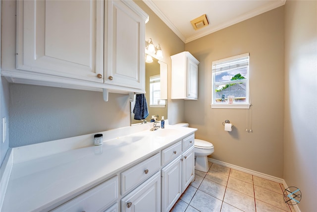 bathroom featuring tile patterned floors, crown molding, vanity, and toilet