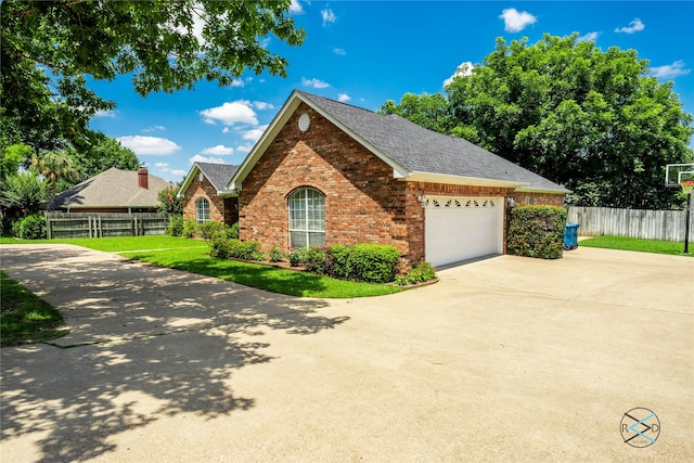 view of front of house featuring a front yard and a garage