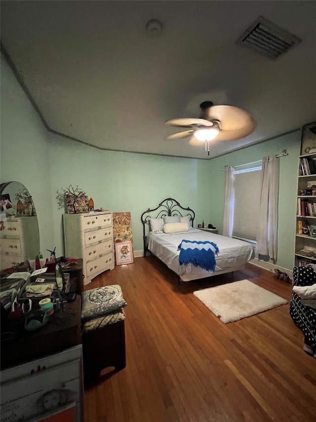 bedroom featuring wood-type flooring and ceiling fan