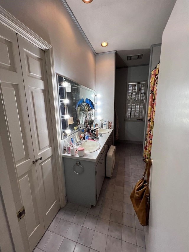 bathroom with tile flooring and vanity