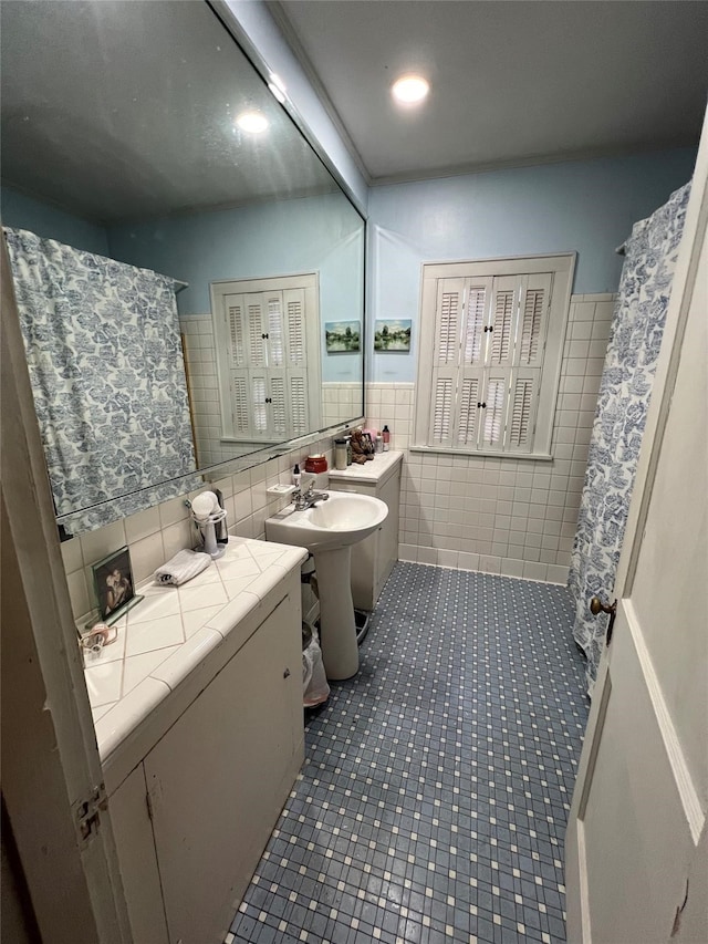 bathroom featuring backsplash, tile flooring, and tile walls