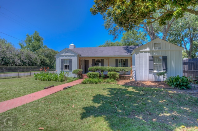 ranch-style home with a front lawn