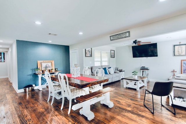 dining room featuring dark hardwood / wood-style flooring and ceiling fan