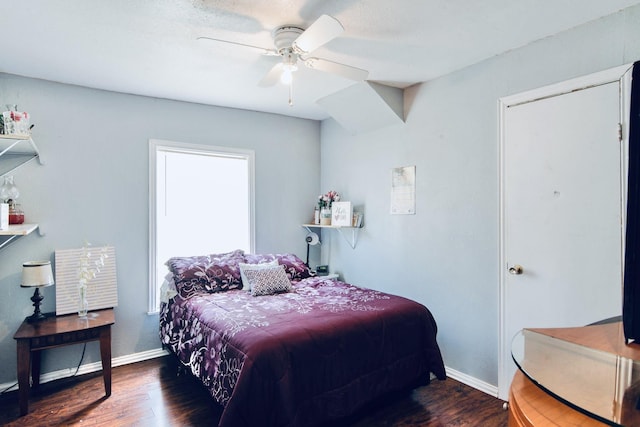 bedroom with ceiling fan and dark hardwood / wood-style floors