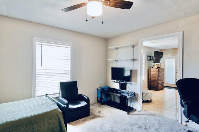 bedroom with light tile patterned floors and ceiling fan