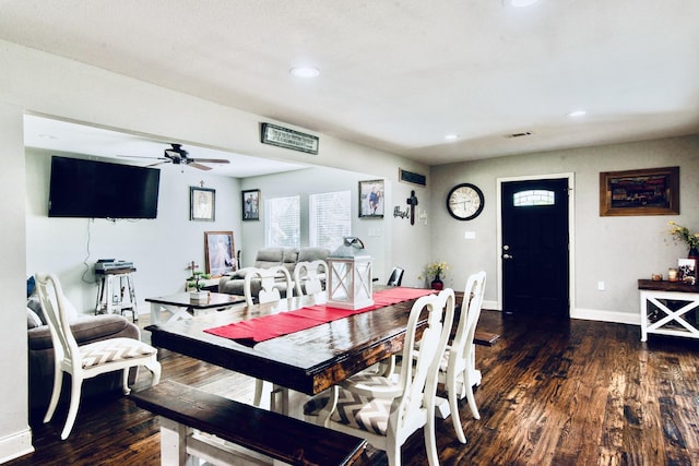 dining room featuring ceiling fan and dark hardwood / wood-style flooring