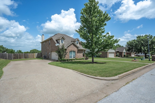 view of front of home featuring a garage and a front yard