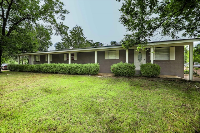 single story home featuring a front lawn