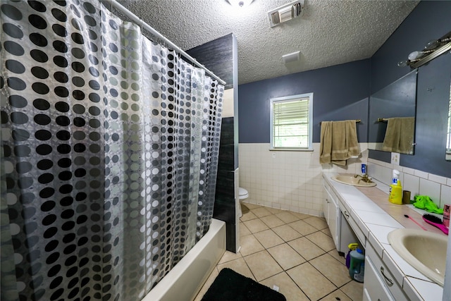 full bathroom featuring double vanity, tile walls, shower / bathtub combination with curtain, backsplash, and toilet