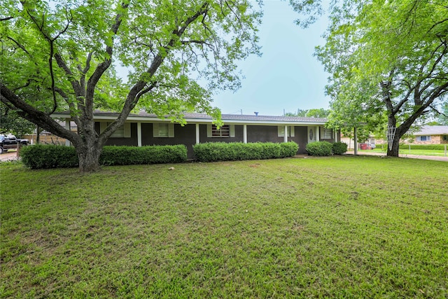 ranch-style house with a front lawn