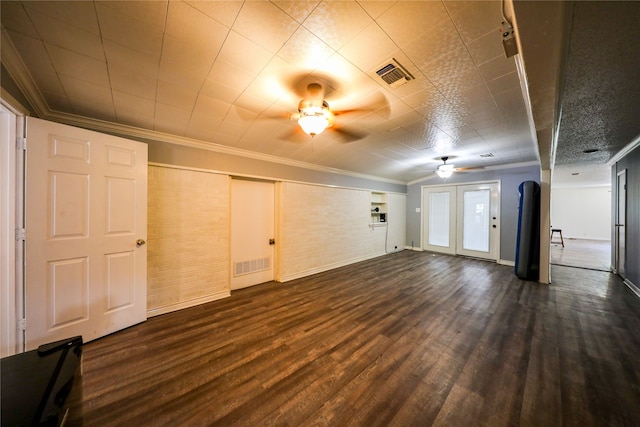 basement with hardwood / wood-style floors, ceiling fan, and crown molding